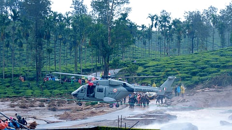 An IAF helicopter during rescue operations after landslides triggered by heavy monsoon rains, at Chooralmala in Wayanad district.