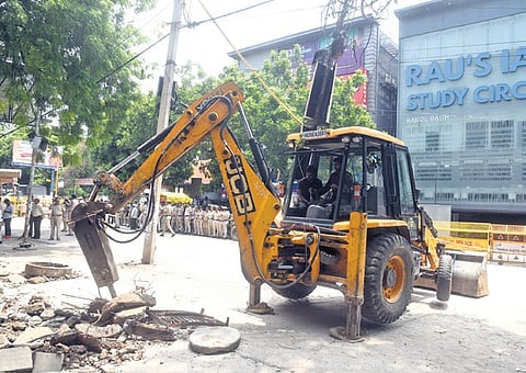 Two bulldozers were deployed to excavate the footpaths on both sides of Bada Bazar Road.