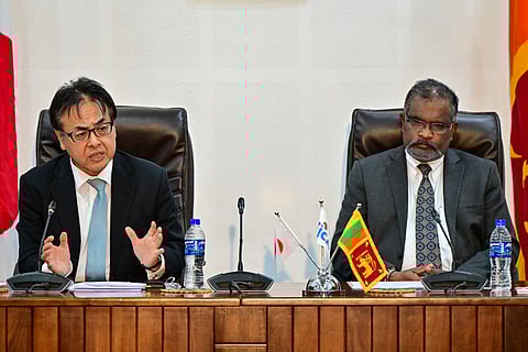 Japan's ambassador to Sri Lanka Hideaki Mizukoshi (L) and Secretary to Sri Lanka's finance ministry Mahinda Siriwardana