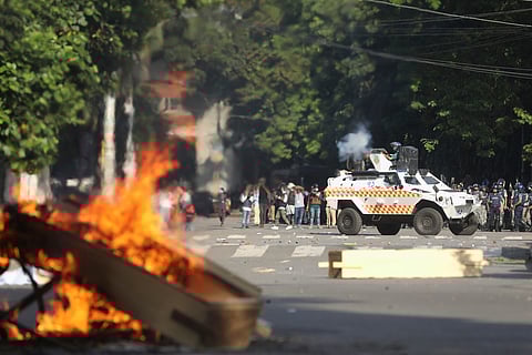 Police fire tear gas shells and rubber bullets to disperse students shouting slogans in favor of quota system in public service at the university campus, in Dhaka, Bangladesh, Wednesday, July 17, 2024.