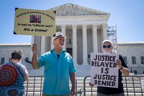 People protest, Monday, July 1, 2024, outside the Supreme Court in Washington, as decisions are announced.