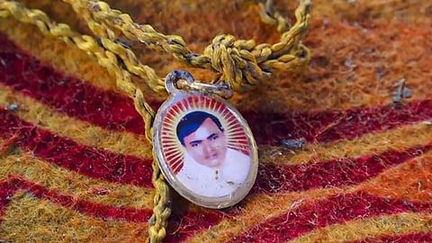 A locket depicting Suraj Pal Singh aka Bhole Baba at the spot a day after a massive stampede that took place during a 'satsang' in Hathras district, Uttar Pradesh on July2, 2024.