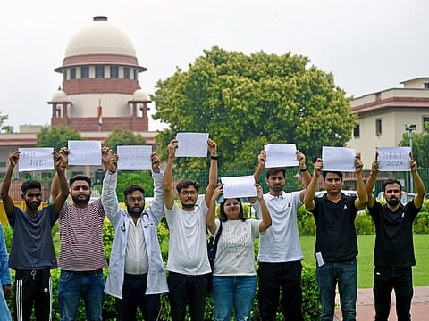 Students protesting against irregularities in the NEET UG exam during a SC hearing in the case.