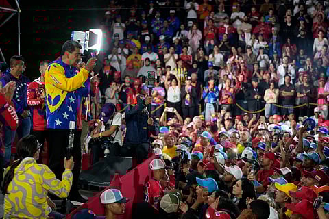President Nicolas Maduro addresses supporters gathered outside the Miraflores presidential palace after electoral authorities declared him the winner of the presidential election in Caracas, Venezuela, Monday, July 29, 2024.