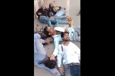 Screengrab from the viral video that shows bleeding Faizan along with other men.