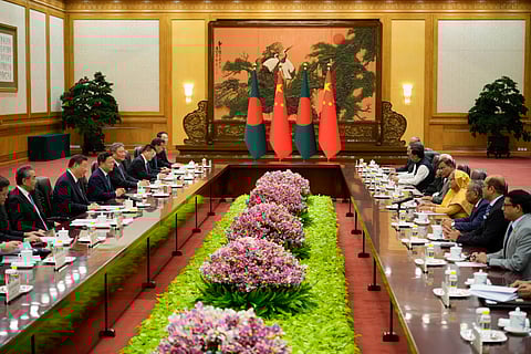 Chinese President Xi Jinping, second from left, and his delegation attend a meeting with Bangladesh Prime Minister Sheikh Hasina, fourth from right, at the Great Hall of the People in Beijing, China