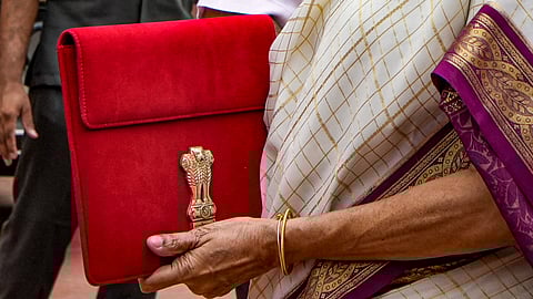 Union Finance Minister Nirmala Sitharaman with a red pouch carrying the Budget documents arrives at the Parliament to present the Union Budget 2024-25.