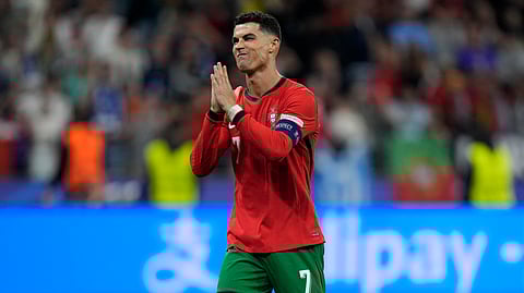 Portugal's forward Cristiano Ronaldo reacts after scoring in a penalty shoot-out during the UEFA Euro 2024 round of 16 football match between Portugal and Slovenia at the Frankfurt Arena in Frankfurt am Main on July 1, 2024.