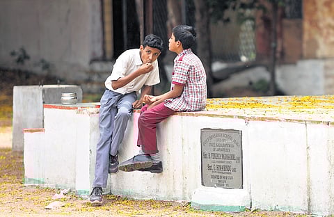 School boys have lunch at the Aliya Government High School in Hyderabad on Thursday even as other schools remained closed.