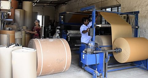 Workers at a Corrugated box manufacturing unit at Thudiyalur in Coimbatore, Tamil Nadu.