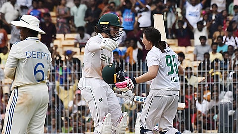 Sune Luus (R) celebrates her hundred with Laura Wolvaardt on Sunday