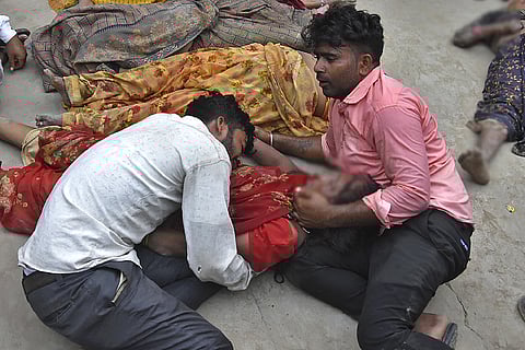Hathras Stampede: Bodies on ice blocks, kin wait for autopsy; others look for missing loved ones.