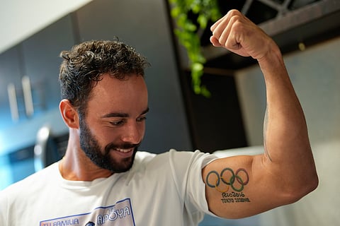 Fernando Dayán Jorge displays an Olympic tattoo on his bicep, June 26, 2024, in Cape Coral, Fla.