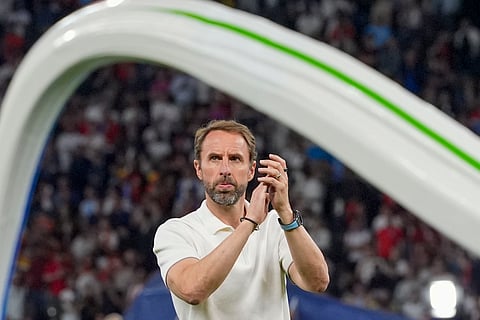 England's manager Gareth Southgate applauds to supporters at the end of the final match between Spain and England at the Euro 2024 football tournament in Berlin, Germany.