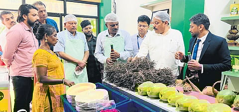 JSS and NABARD officials tasting food items at Engale Cafe in Nilambur