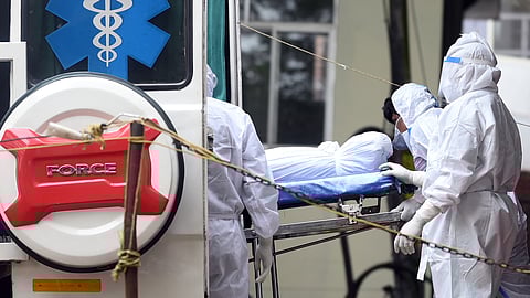 The mortal remains of the Malappuram native who died of Nipah being shifted to Kozhikode Medical College Hospital mortuary.