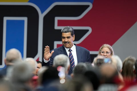 Venezuelan President Nicolas Maduro arrives with his wife Cilia Flores for a ceremony where the National Electoral Council (CNE) certifies that he won the presidential election, at the CNE in Caracas, Venezuela