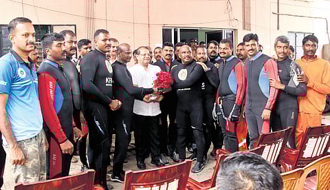 Fire and Rescue Services director K Padmakumar felicitating scuba divers of the force who were engaged in the efforts to rescue sanitation worker Joy who went missing in the Amayizhanchan canal. The divers were felicitated at the Fire and Rescue Services headquarters in Thiruvananthapuram on Monday