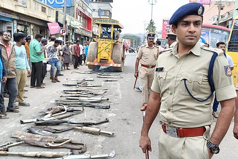 In the presence of Kolar Superintendent of Police Nikhil B silencers being crushed in a road roller.