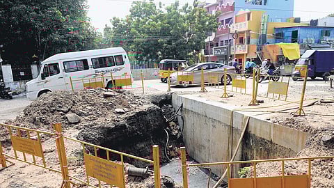 A 10-foot wide pit formed during the construction of a drain at JPC Main Road in Mogappair West market in Chennai