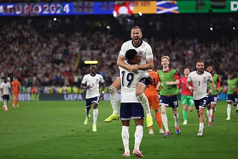 England's forward Harry Kane celebrates with England's forward #19 Ollie Watkins after winning the UEFA Euro 2024 semi-final football match between the Netherlands and England on July 10, 2024.