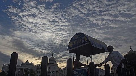 Ice Candy Man selling candies under a Monsoon clouds in Bengaluru on Monday evening .