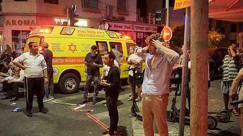 People gather at the scene of an deadly explosion in Tel Aviv, Israel.