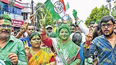 Trinamool Congress supporters celebrate after party candidate Madhuparna Thakur won the Bagda assembly by-election, in North 24 Parganas on Saturday
