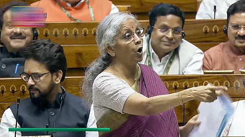 i: Union Finance Minister Nirmala Sitharaman speaks in the Lok Sabha during the Monsoon session of Parliament, in New Delhi.