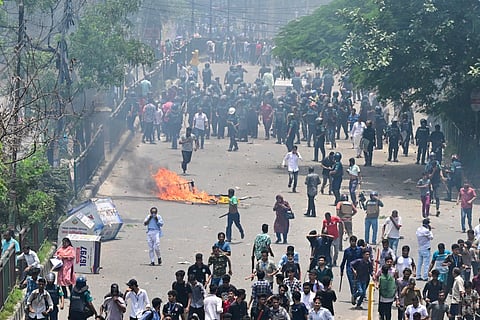 Anti-quota protesters clash with the police in Dhaka