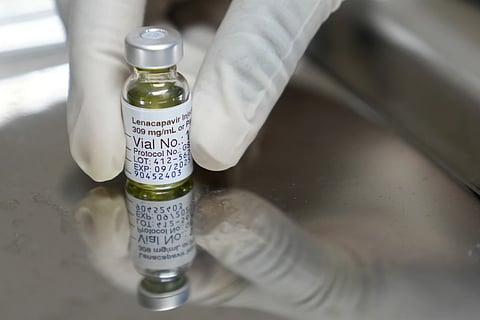 A pharmacist holds a vial of lenacapavir, the new HIV prevention injectable drug, at the Desmond Tutu Health Foundation's Masiphumelele Research site, in Cape Town, South Africa, Tuesday, July 23, 2024, which was one of the sites for Gilead's lenacapavir drug trial.