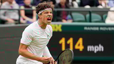 Ben Shelton of the United States reacts after winning a point against Denis Shapovalov of Canada during their third round match at the Wimbledon tennis championships in London, Saturday, July 6, 2024.