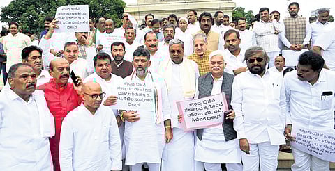 Chief Minister Siddaramaiah, Deputy CM D K Shivakumar, ministers and Congress workers protest against the Centre in Bengaluru on Tuesday