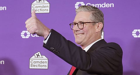 Britain's Labour Party leader Keir Starmer gives a thumbs up to his supporters after he was elected for the Holborn and St Pancras constituency, in London, Friday, July 5, 2024.