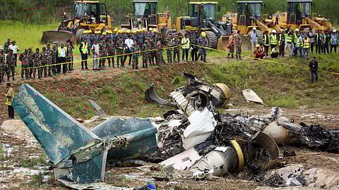 Nepal army personnel cordon off a plane crash site at Tribhuvan International Airport in Kathmandu, Nepal, Wednesday, July 24, 2024.