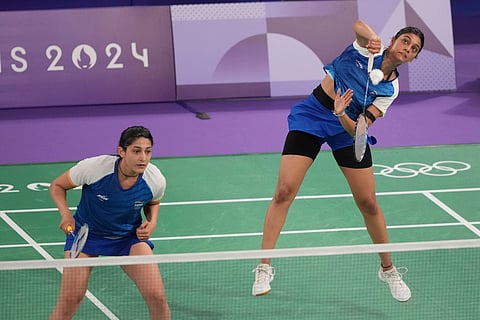India's Tanisha Crasto and Ashwini Ponnappa play against Japan's Nami Matsuyama and Mayu Matsumoto during their women's doubles badminton group stage match at Port de la Chapelle Arena during the 2024 Summer Olympics