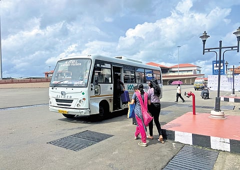 Passengers boarding a KMRL feeder bus to Aluva at Nedumbassery airport on Friday