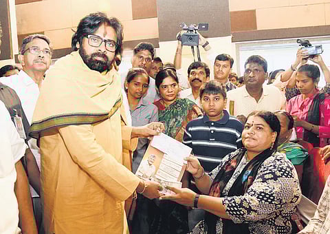 Deputy Chief Minister Pawan Kalyan distributes social security pensions under NTR Bharosa to beneficiaries at Gollaprolu on Monday.