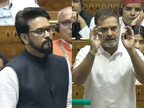 Leader of Opposition in Lok Sabha and Congress MP Rahul Gandhi (R) and BJP MP Anurag Thakur in the House during the Monsoon session of Parliament