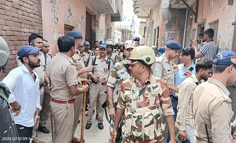 Police forces amidst rising tension in the Mangalur assembly seat.