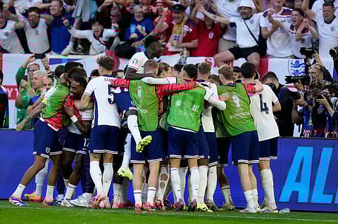 England's celebrate their team victory after the penalty shootout during a quarterfinal match between England and Switzerland at the Euro 2024 soccer tournament in Duesseldorf, Germany, Saturday, July 6, 2024.