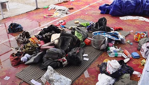Bags and other belongings lying at the scene a day after a massive stampede that took during a 'satsang' (religious congregation), in Sikandara Rao area in Hathras district, Wednesday, July 3, 2024.