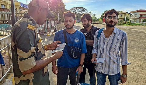Indian students returned from Bangladesh after immigration clearance amid a countrywide protest at Agartala integrated checkpost, on Saturday.