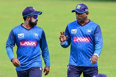 Charith Asalanka with Sanath Jayasuriya (Photo | SLC)