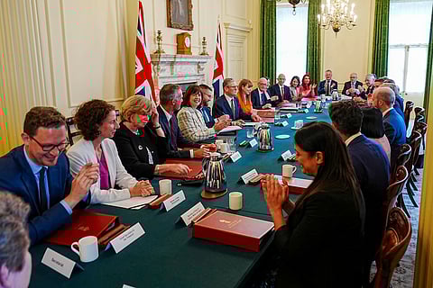 Britain's Prime Minister Keir Starmer, center, with Deputy Prime Minister Angela Rayner, center right, hosts his first Cabinet meeting at 10 Downing Street, London, Saturday July 6, 2024. following the General Election victory for the Labour Party.