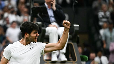 Spain's Carlos Alcaraz celebrates winning against USA's Tommy Paul during their men's singles quarter-finals tennis match on July 9, 2024.