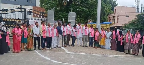 BRS councillors showing victory symbol after winning the no confidence motion against the Congress Vice chairman infront of the municipal office.