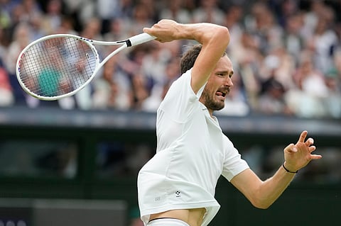Daniil Medvedev plays a forehand return to Jannik Sinner during their quarterfinal (Photo | AP)