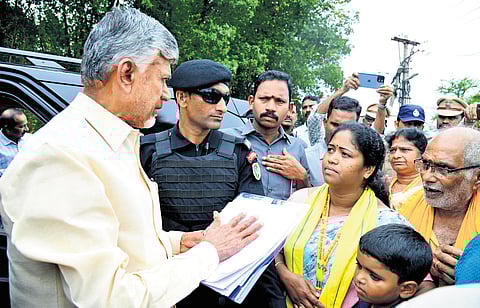 Chief Minister N Chandrababu Naidu interacts with the people on Karakatta on his way to the State Secretariat from his Undavalli residence on Friday I Express