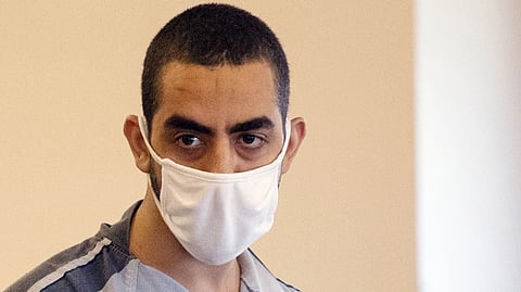 Hadi Matar, charged with stabbing author Salman Rushdie, listens during an arraignment in the Chautauqua County Courthouse in Mayville, N.Y., Aug. 18, 2022.